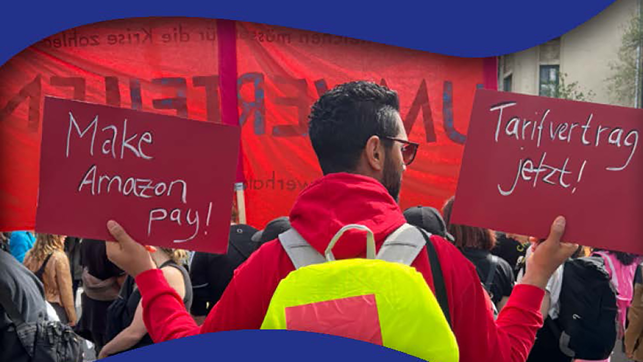 A demonstrating man with signs in his hands demanding better working conditions for workers covered by collective agreements.